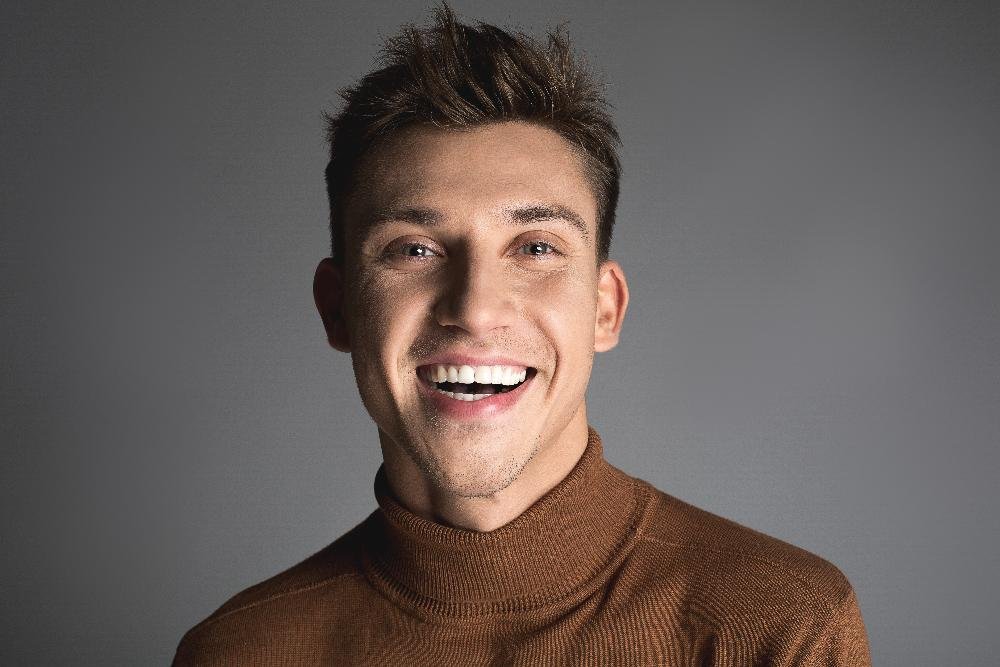 man in turtleneck sweater smiling | teeth whitening los gatos ca