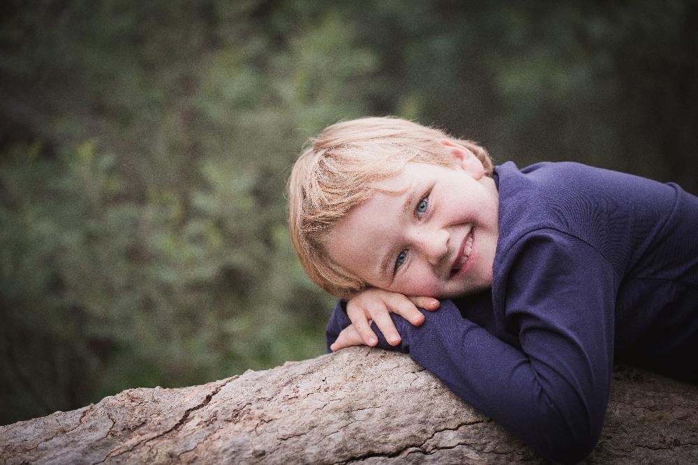 young boy smiling with sweater | tooth-colored fillings los gatos ca