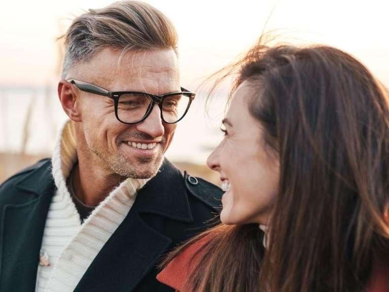 young couple smiling at each other | dental crowns los gatos ca