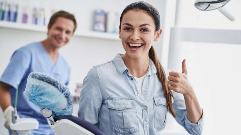 woman giving thumbs up | dentist los gatos ca